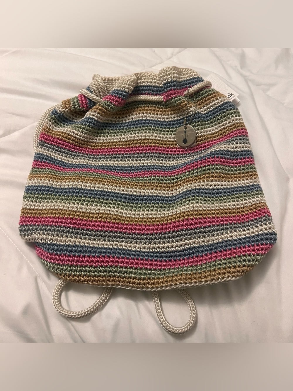 The Sak multicolored crochet drawstring backpack purse